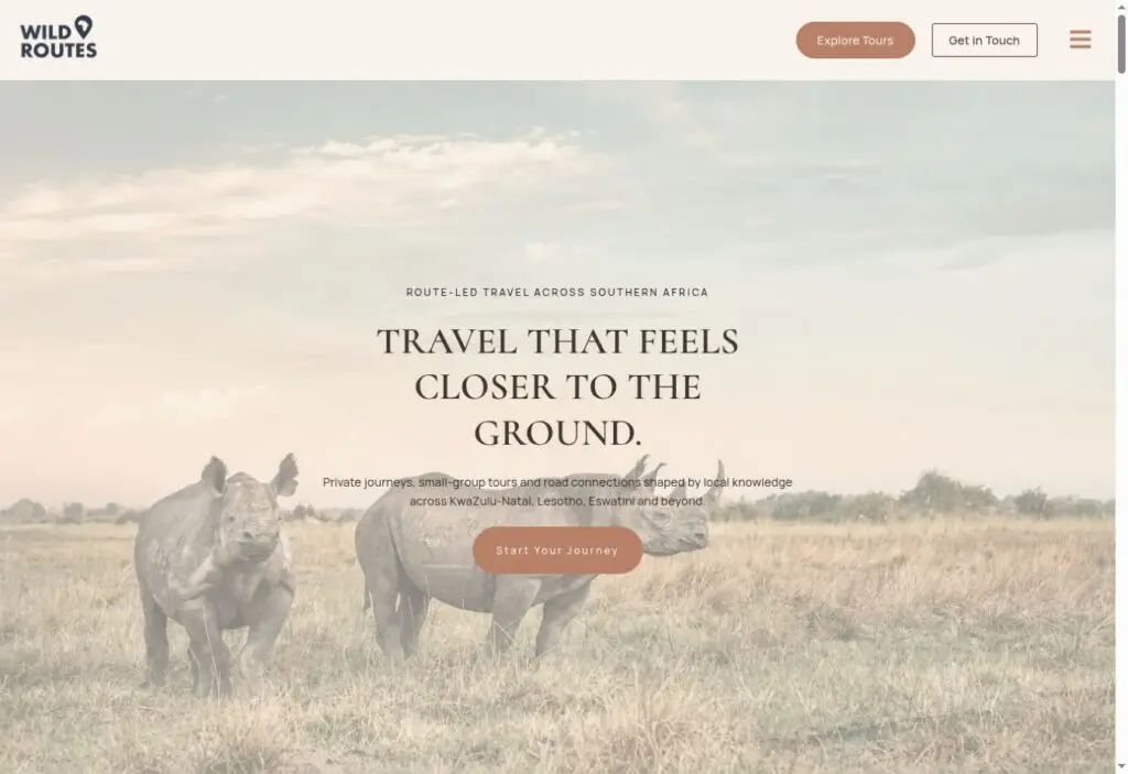 Wild Routes Africa website showing rhinos on the savanna and routes to explore tours or start a journey.