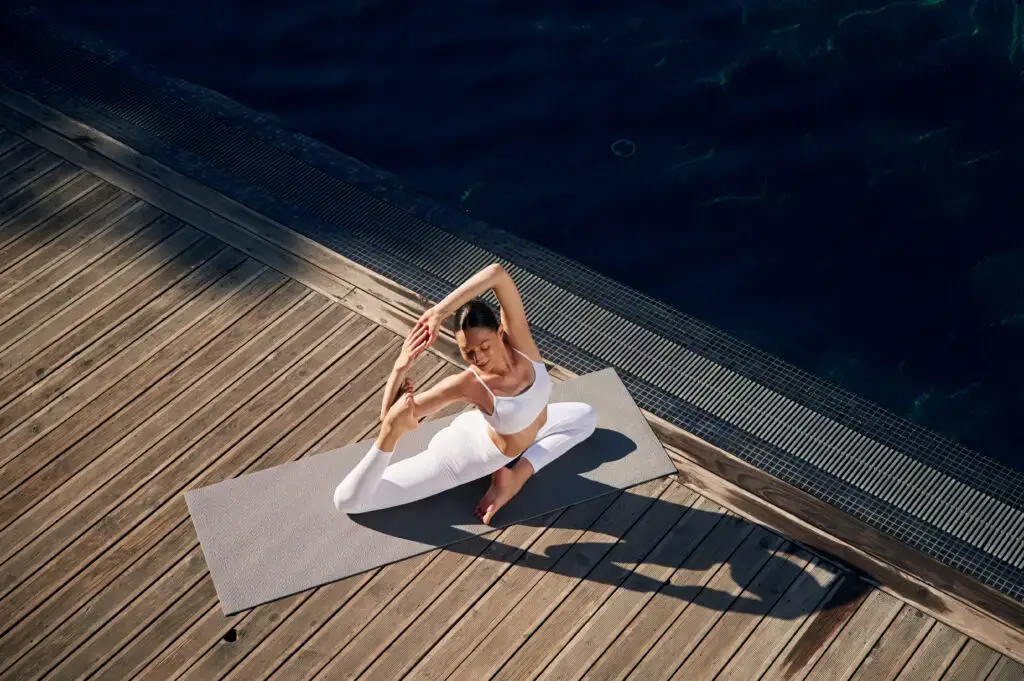 Woman practising yoga at a wellness retreat